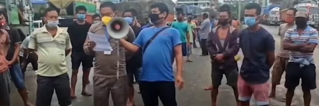 Inter-state goods carriers Drivers set 7-day deadline: Manipur 2 Drivers of inter state transport trucks protesting on the street in Imphal on Monday