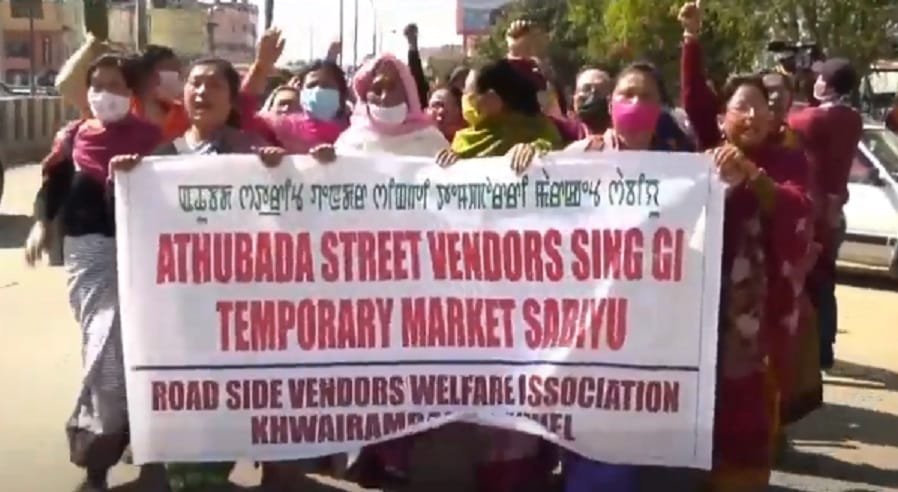 Imphal street vendors’ rally demanding vending space 2 Police stopping a rally of street vendors midway in Imphal on Tuesday 2